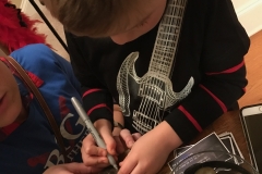 Signing rocks at Drew's 50th birthday party in Holly Springs, NC