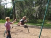 Hunter swinging with Mom