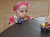 Lily playing with trucks