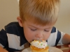 Hunter digs into his birthday cupcake