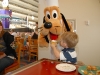 Hunter showing Pluto his cupcake